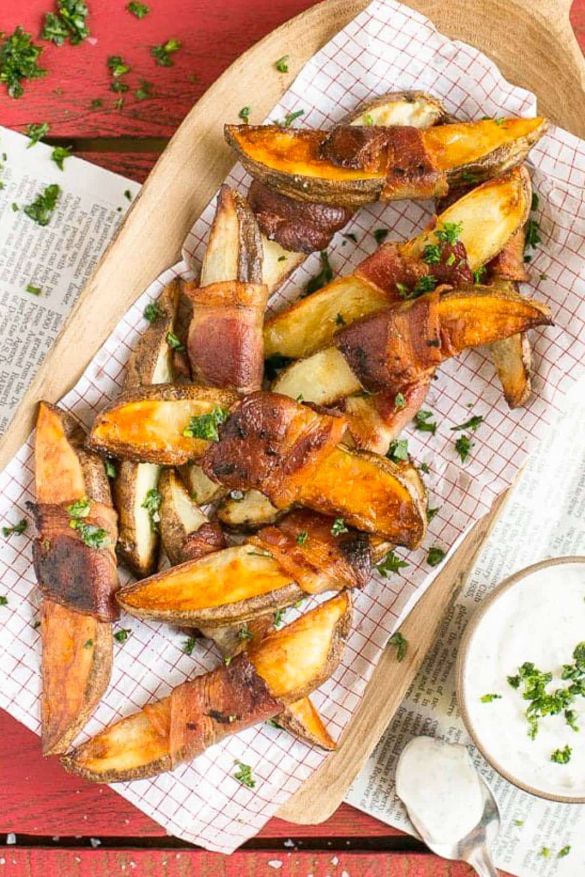 Bacon Wrapped Potato Wedges Recipe | Best Potato Wedges | Bacon Wrapped French Fries | Bacon Potato Wedges #bacon #potato #fries #dinner #sraye Potato wedges on a sheet of parchment paper that have been roasted.