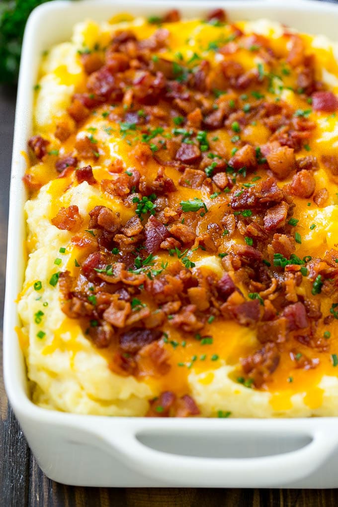 Loaded Mashed Potato Casserole Recipe | Loaded Potatoes | Bacon Mashed Potatoes | Thanksgiving Mashed Potatoes #potatoes #bacon #cheese #casserole #Thanksgiving #dinner #sraye A casserole of loaded mashed potatoes topped with cheddar cheese, crispy bacon and chives.