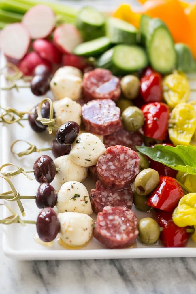 Antipasto Skewers Recipe | Easy Antipasto | Best Antipasto #antipasto #skewers #appetizer #sraye Antipasto skewers on a white serving platter.