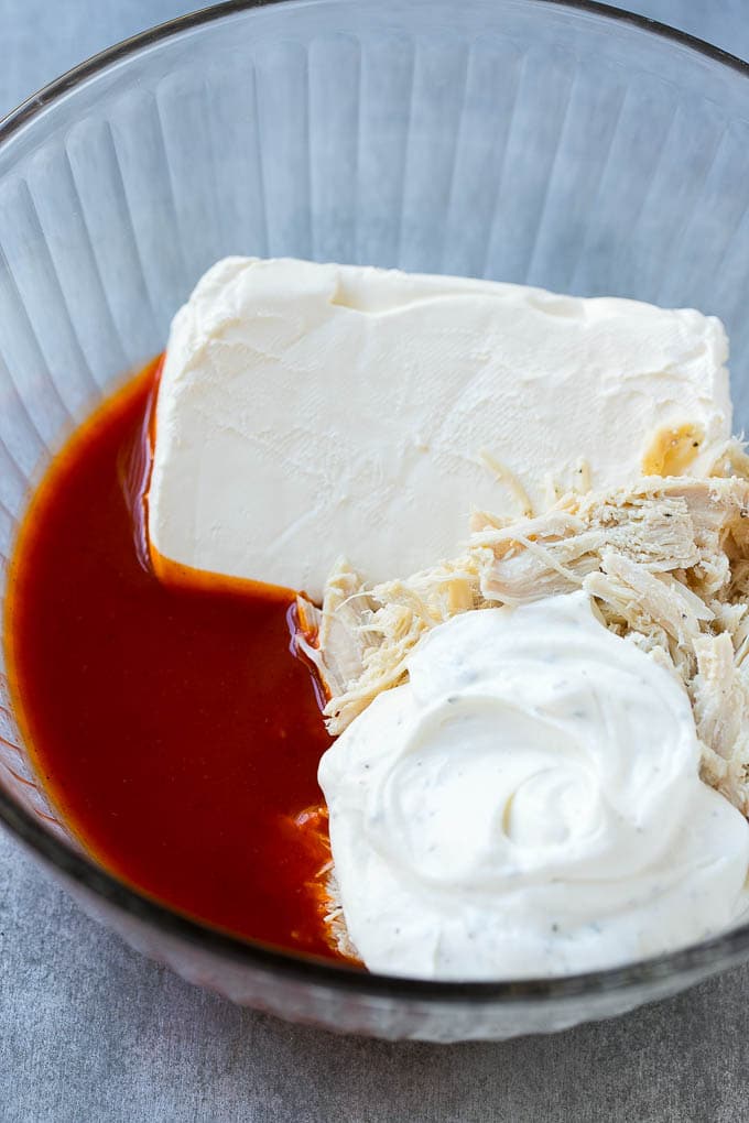 Buffalo Ranch Chicken Dip | Buffalo Chicken Dip | Baked Buffalo Dip | Cheesy Buffalo Dip #buffalowings #buffalochicken #dip #lowcarb #appetizer #sraye Ingredients for the dip in a bowl.