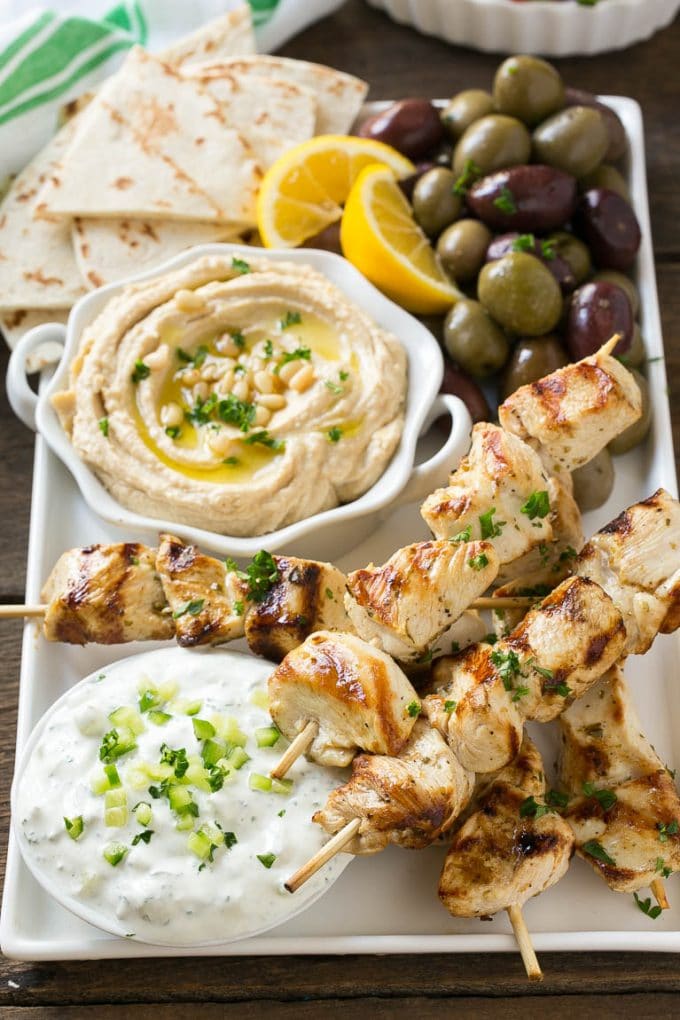 Greek Chicken Souvlaki Recipe | Easy Greek Chicken | Chicken Souvlaki | Greek Chicken Skewers | Easy Greek Chicken Skewers #chicken #kabobs #glutenfree #keto #lowcarb #grilling #sraye Chicken souvlaki skewers marinated in lemon and herbs, then grilled. Served with olives, hummus and pita bread.
