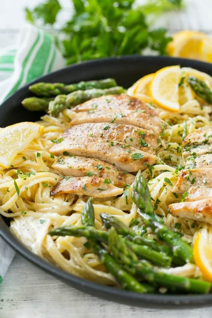 Lemon Asparagus Pasta with Grilled Chicken Recipe | Asparagus Pasta | Grilled Chicken Pasta | Easy Pasta Recipe #pasta #asparagus #lemon #chicken #dinner #sraye A skillet with lemon asparagus pasta, cream sauce and sliced grilled chicken.