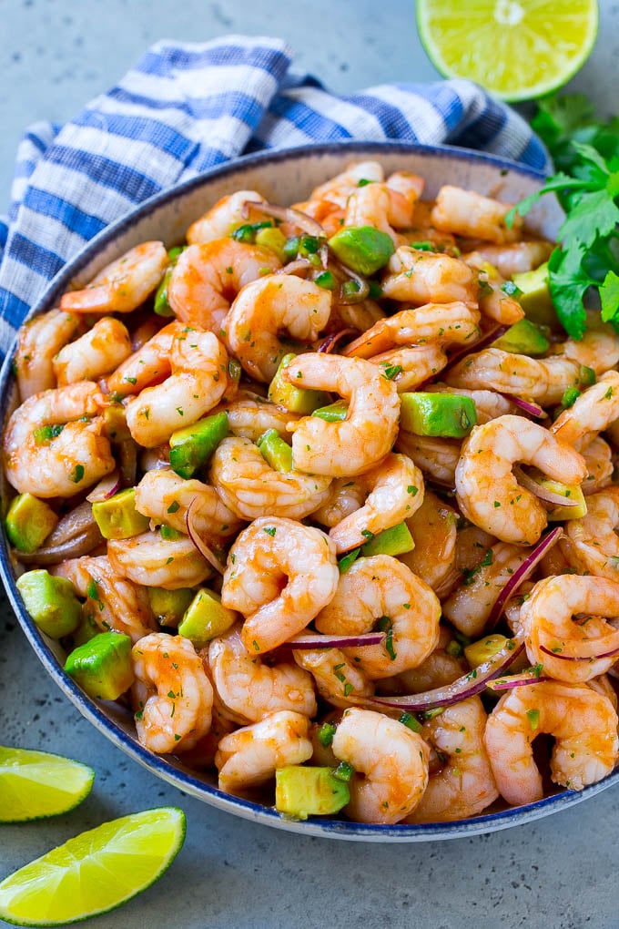 Mexican Shrimp Cocktail Recipe | Coctel de Camarones | Shrimp Cocktail | Mexican Shrimp #shrimp #appetizer #avocado #mexican #sraye A bowl of Mexican shrimp cocktail with red onion, avocado, homemade sauce and cilantro.