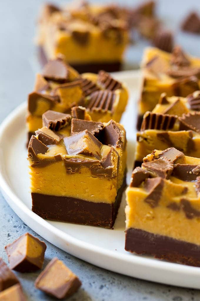 Chocolate Peanut Butter Fudge Recipe | Peanut Butter Cup Fudge | Easy Fudge Recipe #chocolate #peanutbutter #fudge #baking #dessert #sraye Squares of chocolate peanut butter fudge topped with peanut butter cups.