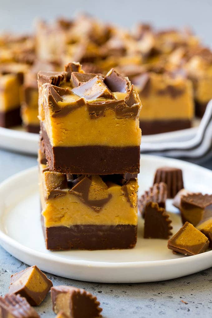 Chocolate Peanut Butter Fudge Recipe | Peanut Butter Cup Fudge | Easy Fudge Recipe #chocolate #peanutbutter #fudge #baking #dessert #sraye Stacked pieces of chocolate peanut butter fudge on a plate.