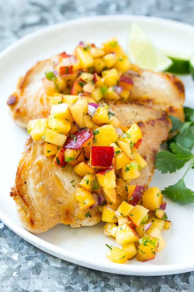 Peach Salsa | Fruit Salsa #peaches #salsa #dip #appetizer #sraye Peach salsa served over grilled chicken breast.