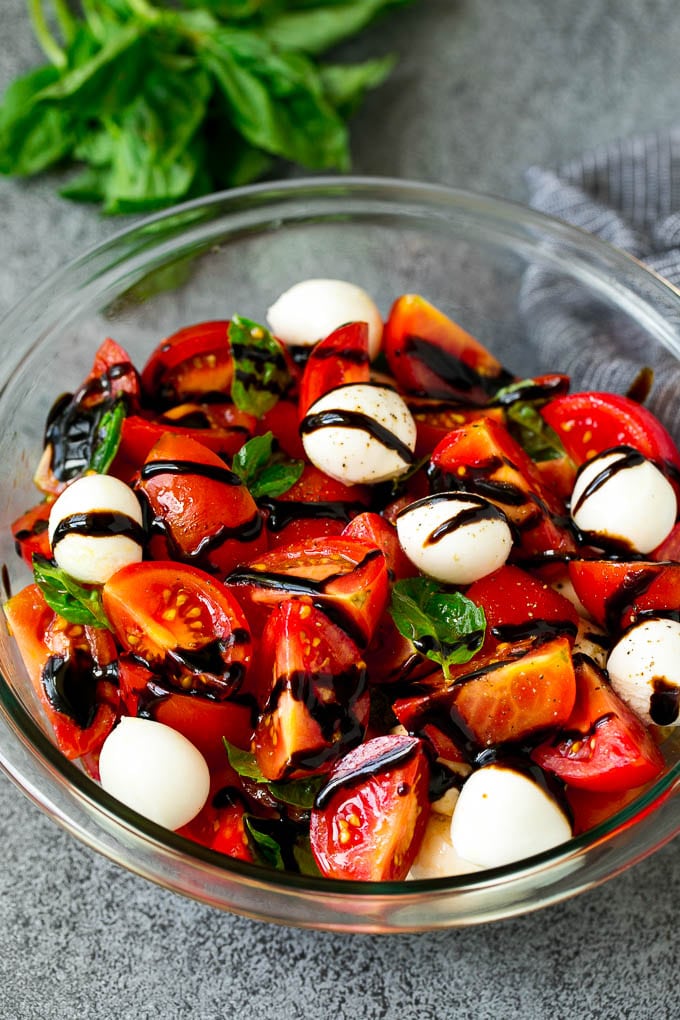 Caprese Salad Recipe | Tomato Salad #salad #tomato #mozzarella #cheese #basil #caprese #summer #sraye Caprese salad with tomatoes, fresh mozzarella, basil leaves and balsamic glaze.