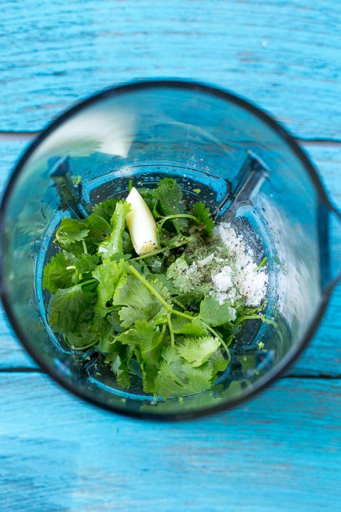 Cilantro Lime Chicken | Grilled Chicken #chicken #grilling #cilantro #lime #dinner #sraye A blender full of cilantro leaves, garlic, lime juice and olive oil.