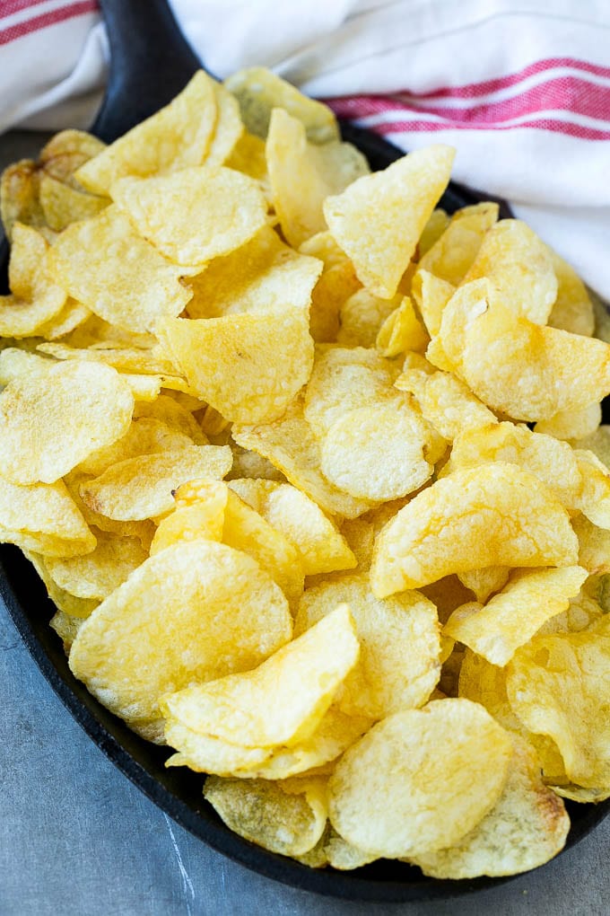 Irish Nachos Recipe | Potato Nachos | Potato Chip Recipe | Appetizer Recipe #nachos #potatoes #cheese #bacon #appetizer #sraye Kettle chips in a skillet.