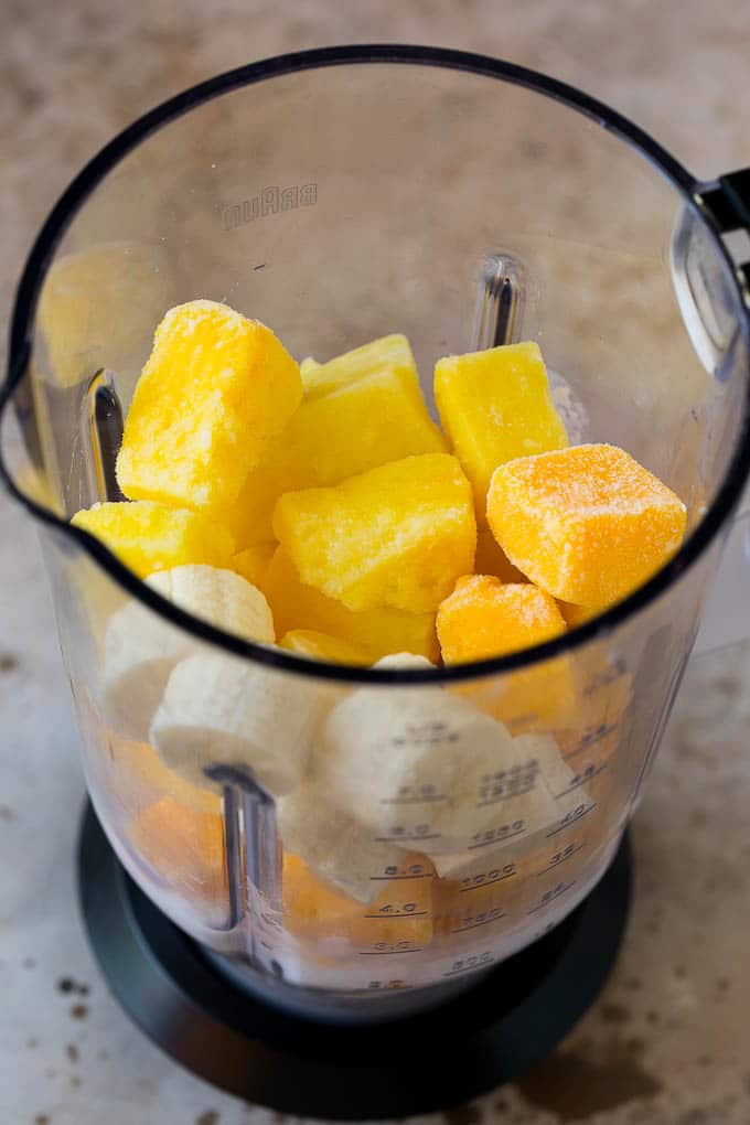 Tropical Smoothie Recipe | Mango Smoothie | Pineapple Smoothie #smoothie #mango #pineapple #banana #drink #sraye Pineapple, mango, banana and coconut milk in a blender.
