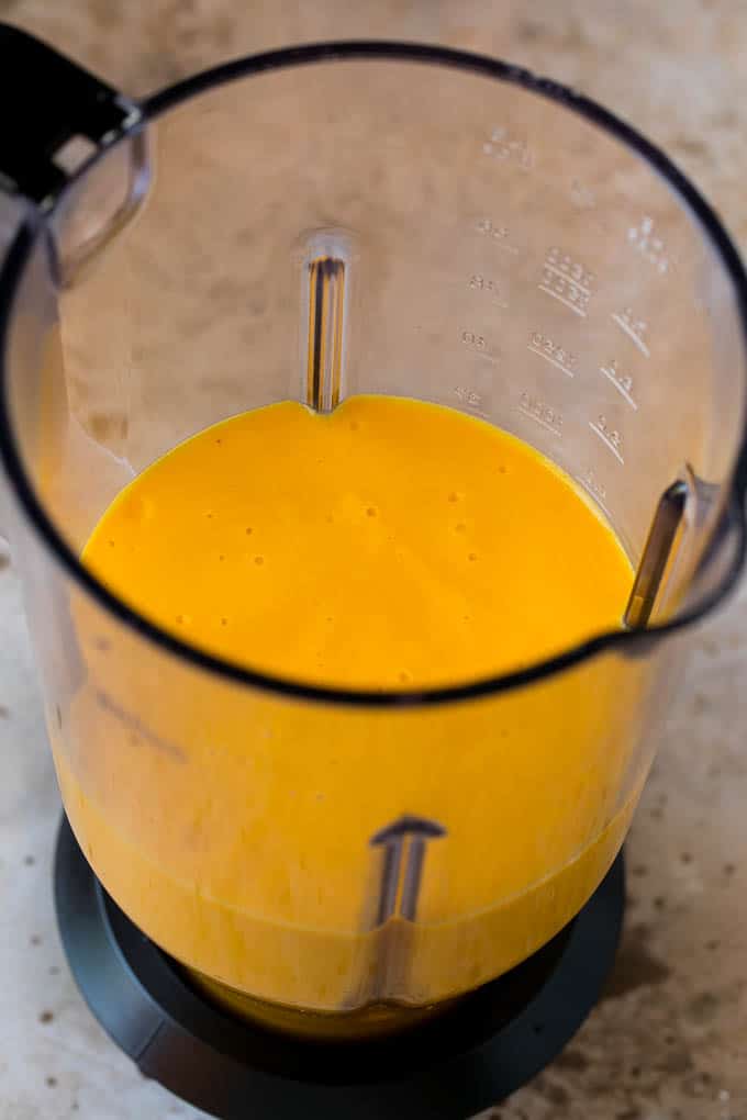 Tropical Smoothie Recipe | Mango Smoothie | Pineapple Smoothie #smoothie #mango #pineapple #banana #drink #sraye A smoothie inside of a blender.