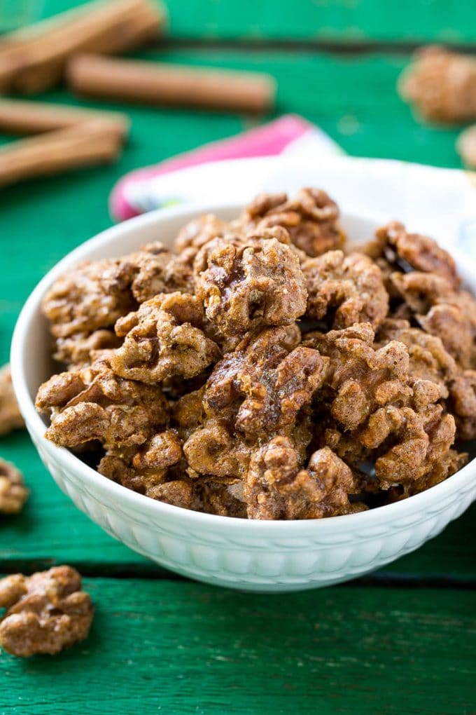 Candied Walnuts Recipe | Candied Nuts | Glazed Walnuts | Cinnamon Sugar Walnuts #walnuts #dessert #snack #sraye A white bowl filled with candied walnuts.