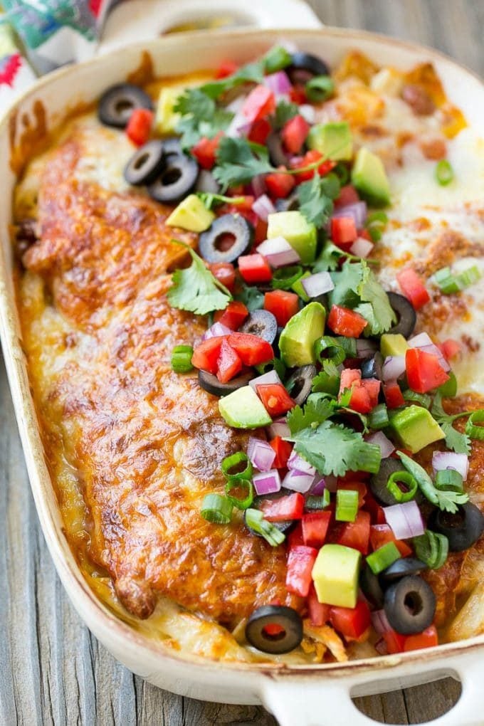 Chicken Enchilada Casserole Recipe | Chicken Enchiladas | Easy Casserole Recipe | Enchilada Casserole #chicken #casserole #enchiladas #cheese #beans #dinner #sraye Chicken enchilada casserole topped with avocado, tomatoes and olives.