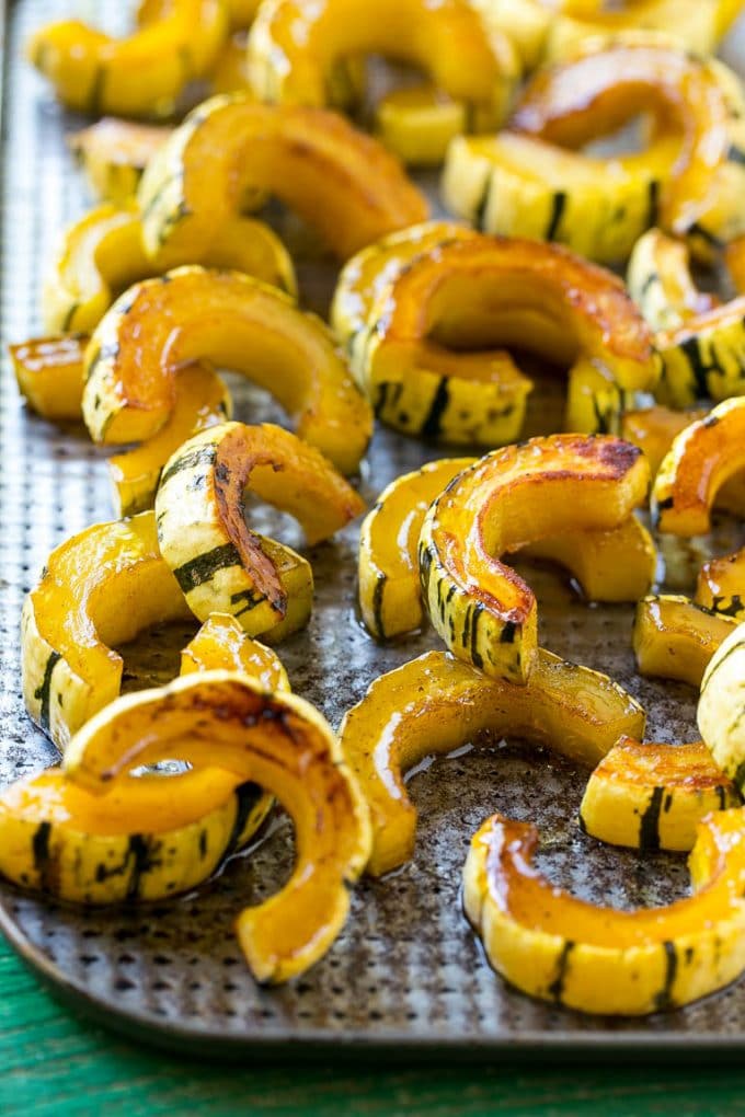 Brown Sugar Delicata Squash Recipe | Roasted Squash | Delicata Squash | Winter Squash Recipe #squash #wintersquash #brownsugar #sidedish #delicatasquash #dinner #sraye A delicata squash recipe with brown sugar roasted squash on a sheet pan.