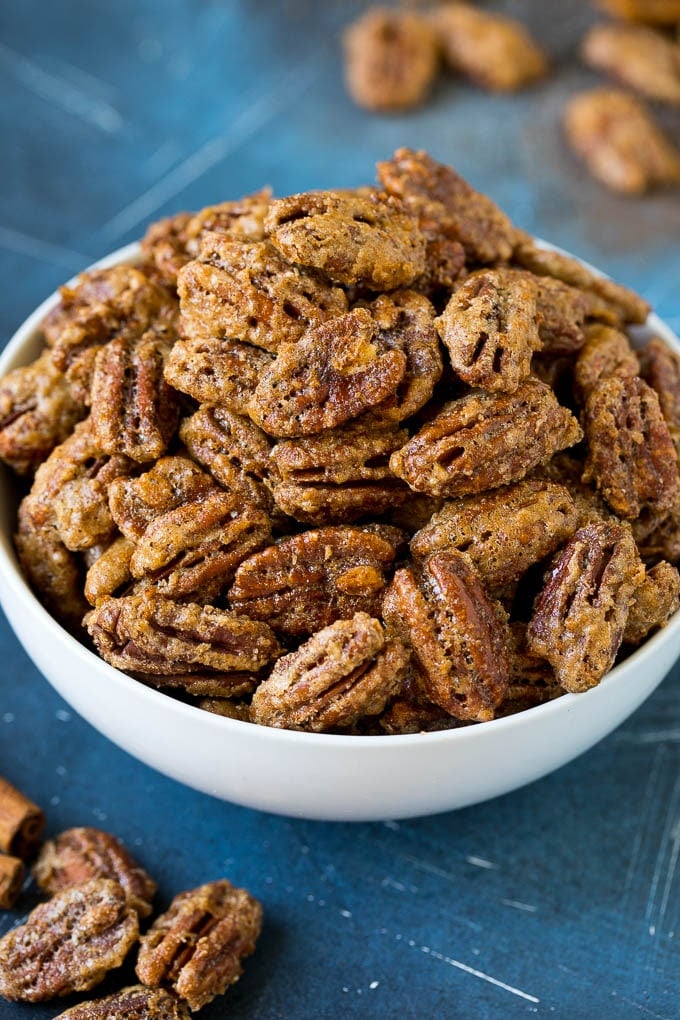 Candied Pecans Recipe | Glazed Pecans | Sugared Pecans #pecans #nuts #snack #dessert #sraye A bowl filled with homemade candied pecans.