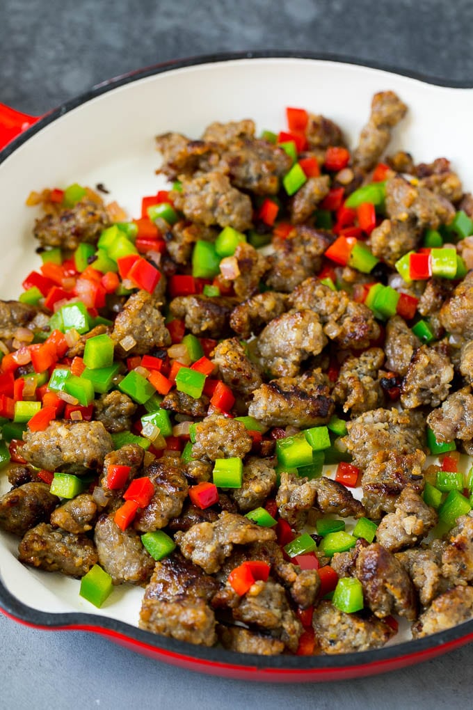 Sweet Potato Hash #sweetpotato #sausage #breakfast #brunch #sraye Sausage, onions and bell peppers in a skillet.