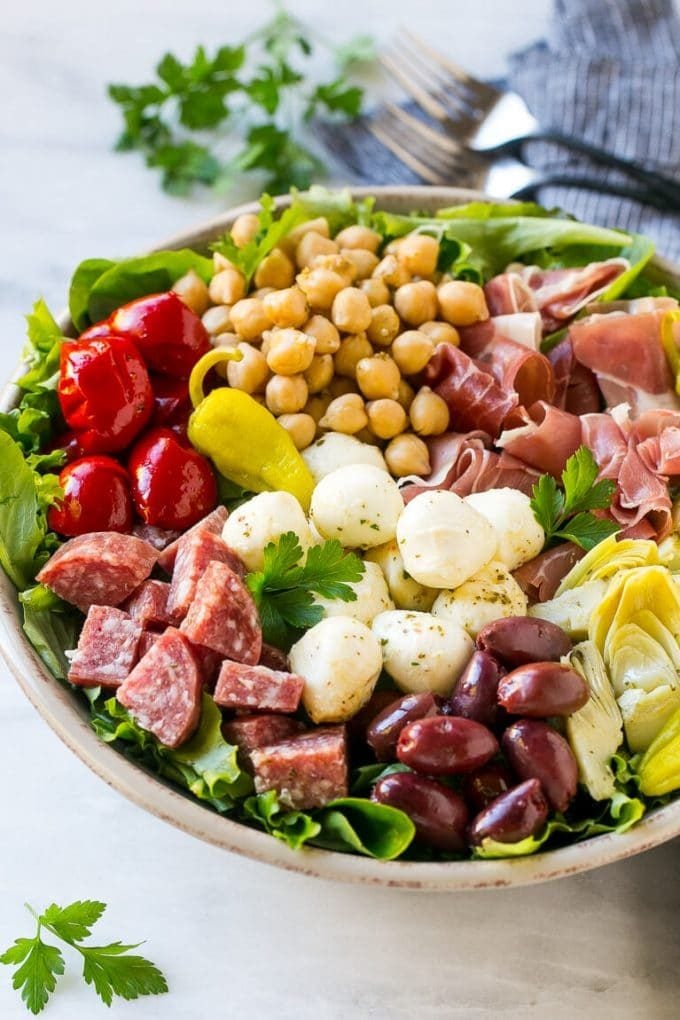 Antipasto Salad Recipe | Italian Salad | Main Course Salad | Antipasto Recipe #salad #salami #italianfood #dinner #lunch #sraye Antipasto salad with cured meats, fresh mozzarella cheese and roasted peppers over salad greens.