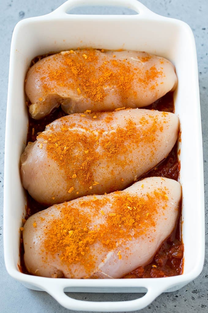 Salsa Chicken Recipe | Baked Chicken | Mexican Chicken #chicken #salsa #mexican #lowcarb #keto #glutenfree #dinner #sraye Poultry in a baking dish topped with taco seasoning.