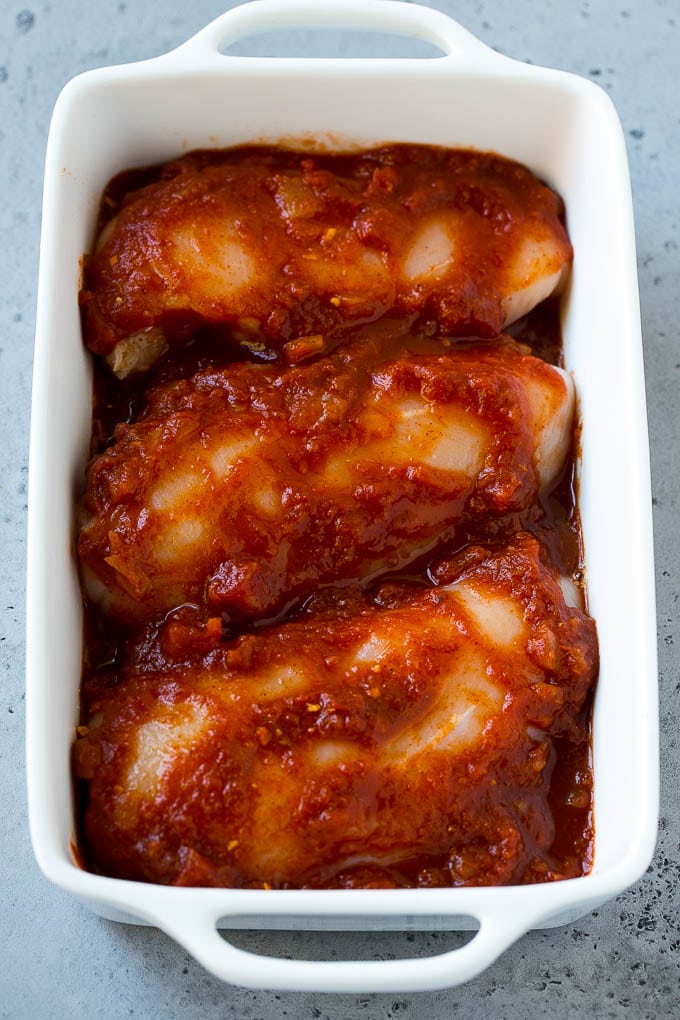 Salsa Chicken Recipe | Baked Chicken | Mexican Chicken #chicken #salsa #mexican #lowcarb #keto #glutenfree #dinner #sraye Chicken breasts in a baking dish coated with salsa.