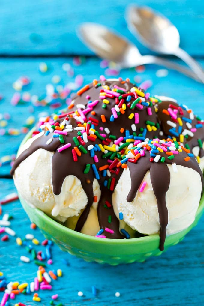 Homemade Magic Shell Recipe | Chocolate Ice Cream Topping | Chocolate Sauce | Hard Chocolate Coating #chocolate #icecream #dessert #sraye Magic shell over scoops of ice cream, topped with rainbow sprinkles.