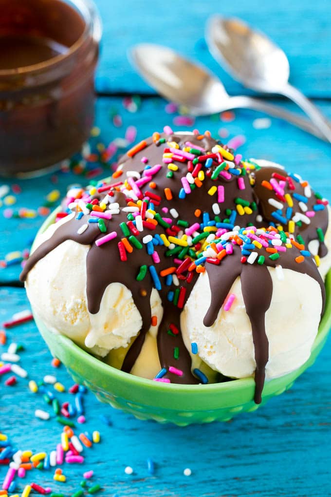 Homemade Magic Shell Recipe | Chocolate Ice Cream Topping | Chocolate Sauce | Hard Chocolate Coating #chocolate #icecream #dessert #sraye Magic shell over vanilla ice cream with rainbow sprinkles.