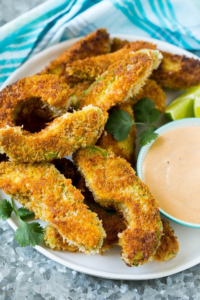 Avocado Fries Recipe | Fried Avocado | Avocado Fritters #avocado #appetizer #snack #sraye A plate of avocado fries served with dipping sauce.
