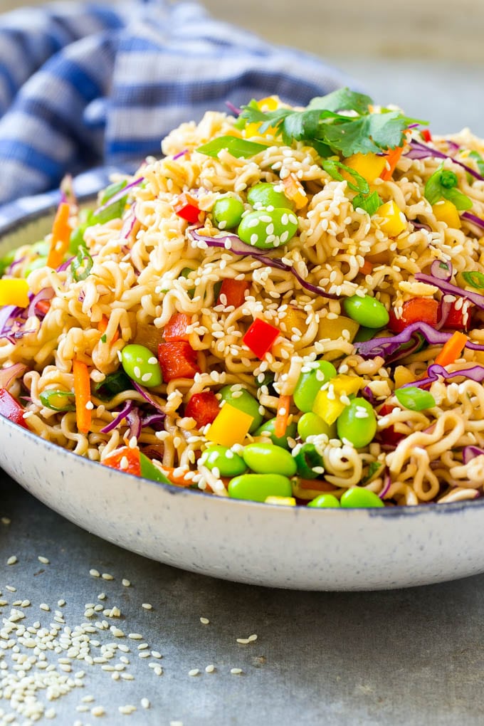 Asian Noodle Salad Recipe | Ramen Noodle Salad | Asian Salad #salad #noodles #edamame #vegetarian #sraye #lunch A mixture of ramen noodles, carrots, edamame, cabbage and peppers in a serving bowl.