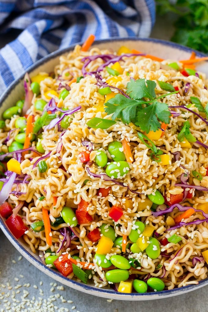 Asian Noodle Salad Recipe | Ramen Noodle Salad | Asian Salad #salad #noodles #edamame #vegetarian #sraye #lunch A bowl of Asian noodle salad with colorful vegetables.