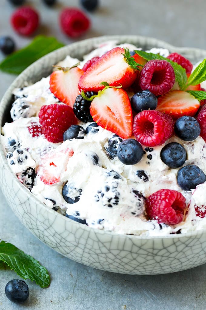 Berry Cheesecake Salad Recipe | Fruit Salad | Berry Fruit Salad | Cheesecake Salad #salad #cheesecake #fruit #berries #sidedish #dessert #sraye A serving bowl of creamy berry salad topped with blueberries, raspberries and strawberries.