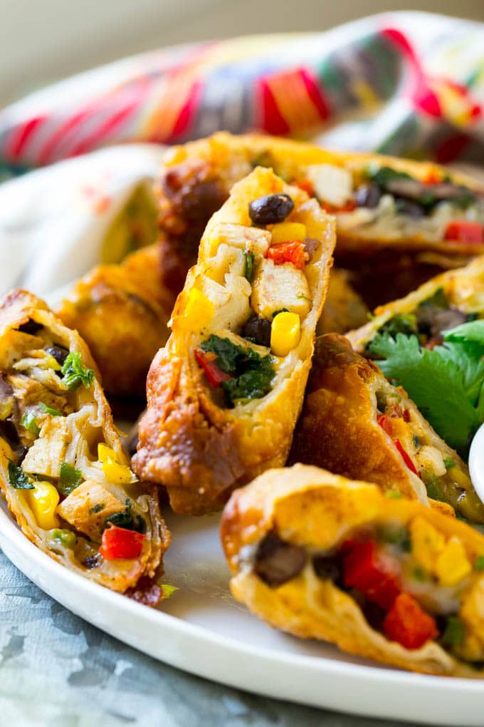 Southwestern Egg Rolls Recipe | Easy Egg Roll Recipe | Mexican Appetizer | Egg Roll Recipe | Southwest Egg Rolls #eggrolls #appetizer #chicken #snack #sraye Chicken egg rolls with colorful vegetables, cut and served with avocado ranch sauce.