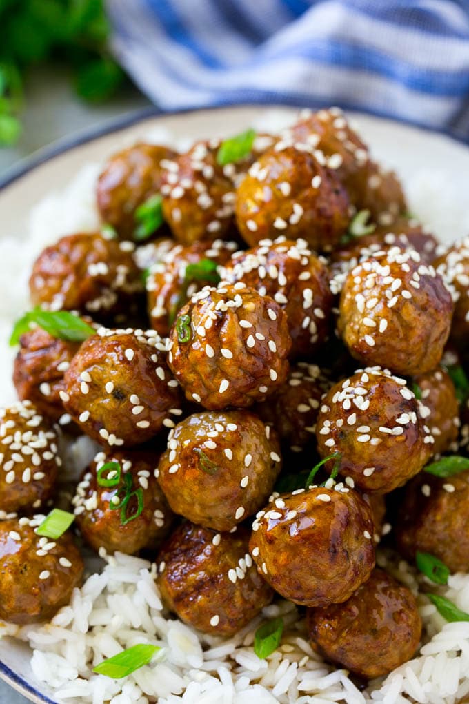 Teriyaki Meatballs Recipe | Asian Meatballs Recipe | Easy Meatball Recipe | Appetizer Meatballs #meatballs #teriyaki #beef #rice #dinner #sraye Meatballs topped with homemade sauce and sesame seeds.