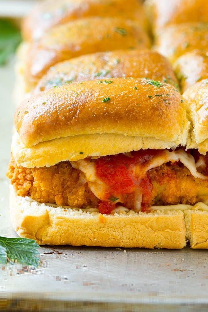 Chicken Parmesan Sliders | Chicken Parmesan Sandwich Recipe | Slider Sandwich Recipe #sliders #chickenparm #chickenparmesan #chickenparmesansliders #dinner #appetizer #sraye Crispy chicken with tomato sauce and cheese on slider buns.