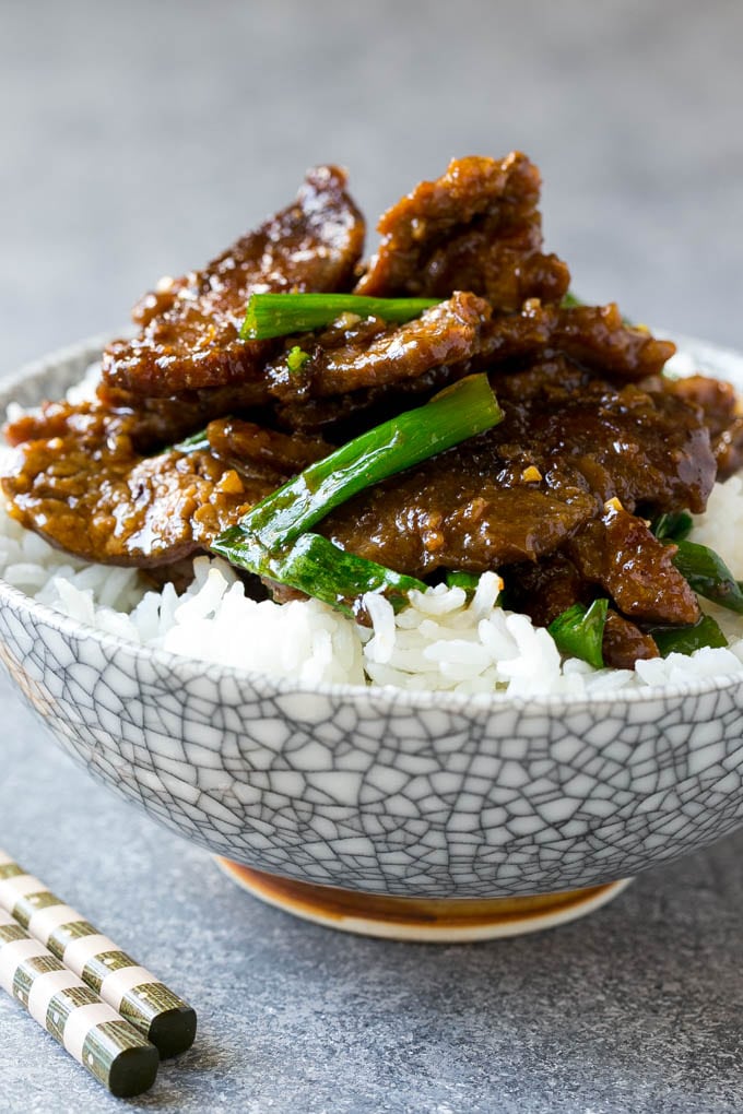 Mongolian Beef Recipe | Asian Beef Recipe | Chinese Beef | Beef Stir Fry #Chinese #Mongolian #Asian #mongolianbeef #beef #sraye #dinner A bowl of mongolian beef over rice.