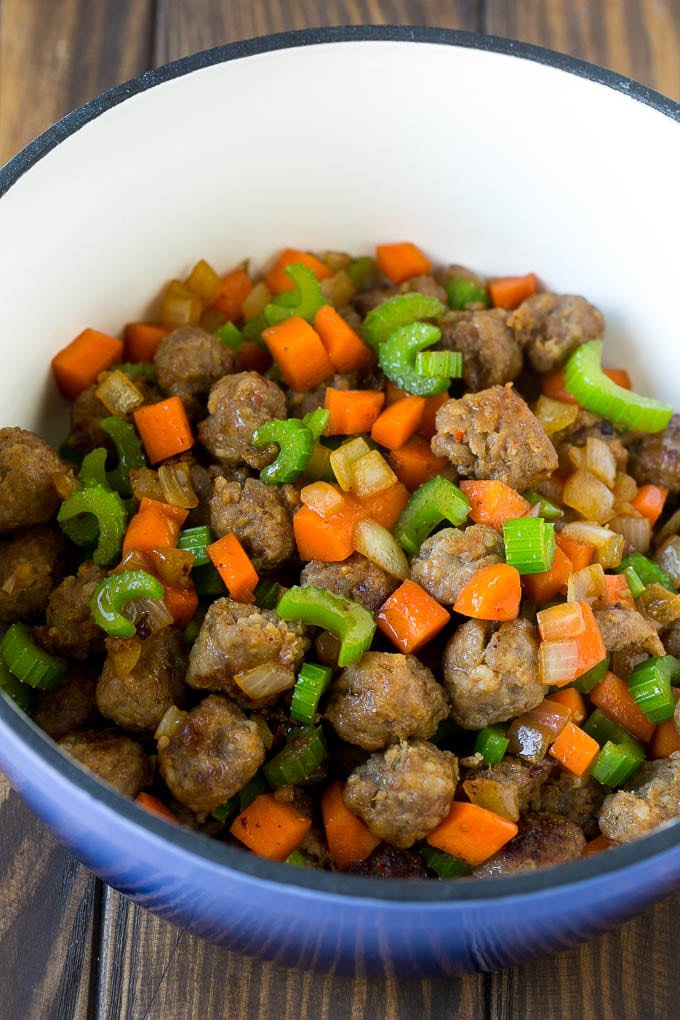 Tortellini Soup Recipe | Sausage Soup | Italian Soup #soup #sausage #pasta #tortellini #dinner #sraye Sausage, carrots, onion and celery in a pot.