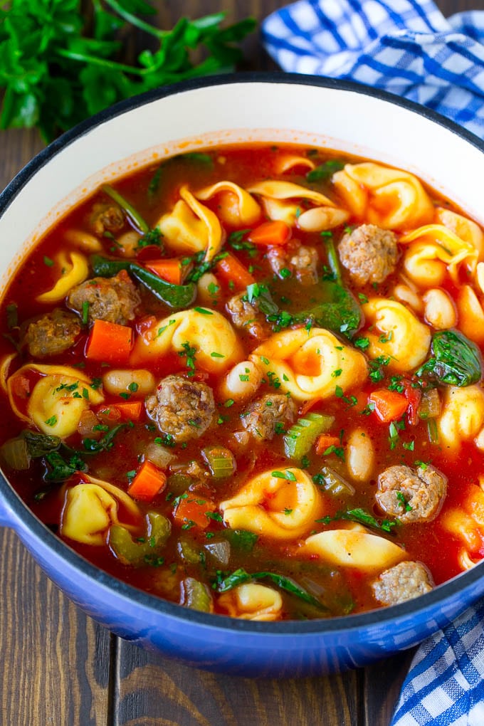 Tortellini Soup Recipe | Sausage Soup | Italian Soup #soup #sausage #pasta #tortellini #dinner #sraye A pot of tortellini soup with tomato broth, Italian sausage, spinach and carrots.