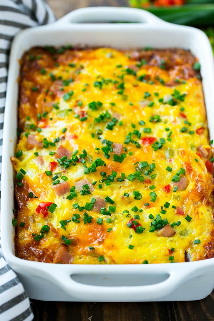 Hash Brown Egg Casserole Recipe | Breakfast Casserole with Ham | Hash Brown Casserole | Ham and Egg Casserole | Egg Casserole with Ham #casserole #breakfast #eggs #egg #hashbrown #sraye Hash brown casserole with ham, vegetables and cheese in a baking dish,