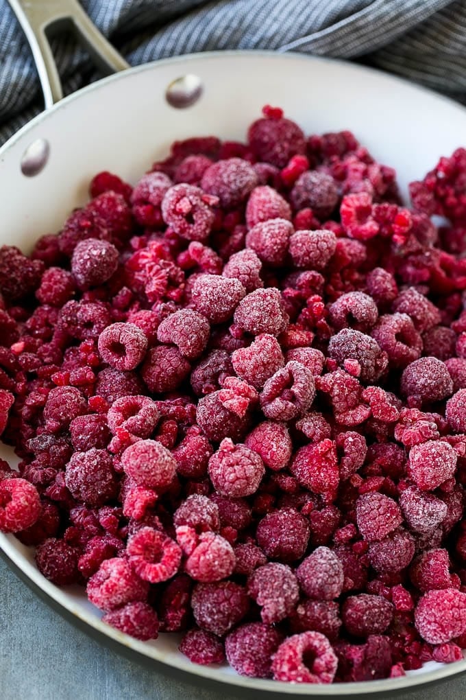 Raspberry Sauce Recipe | Homemade Raspberry Sauce | Raspberry Recipe #raspberries #dessert #sraye A pan of frozen berries.