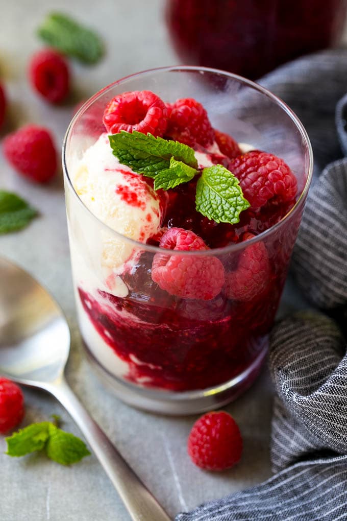 Raspberry Sauce Recipe | Homemade Raspberry Sauce | Raspberry Recipe #raspberries #dessert #sraye A cup of vanilla ice cream with raspberry sauce and fresh raspberries.