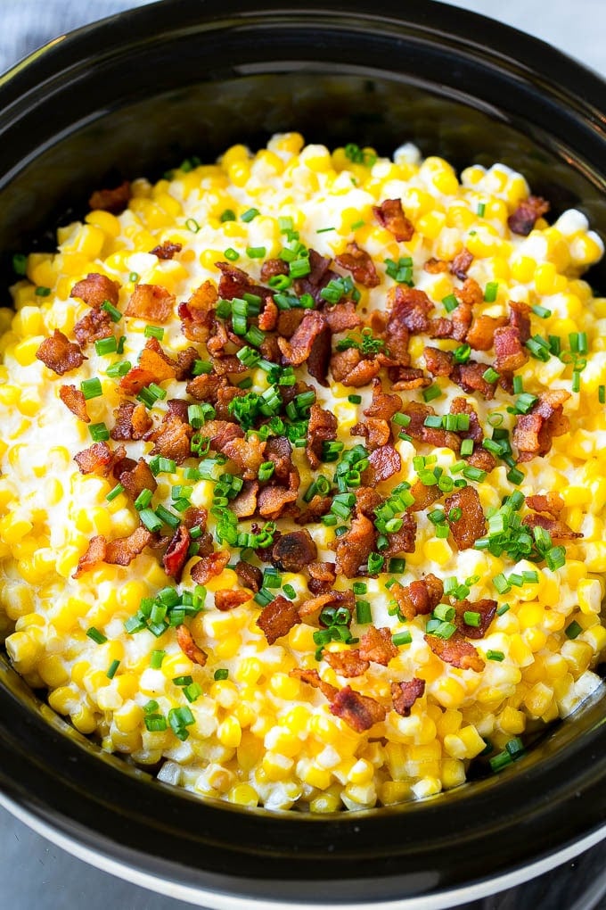 Slow Cooker Creamed Corn Recipe | Easy Creamed Corn Recipe | Slow Cooker Creamed Corn with Bacon | Southern Creamed Corn | Creamed Corn with Cream Cheese #creamedcorn #corn #bacon #crockpot #slowcooker #dinner #sraye Slow cooker creamed corn topped with bacon and chives.