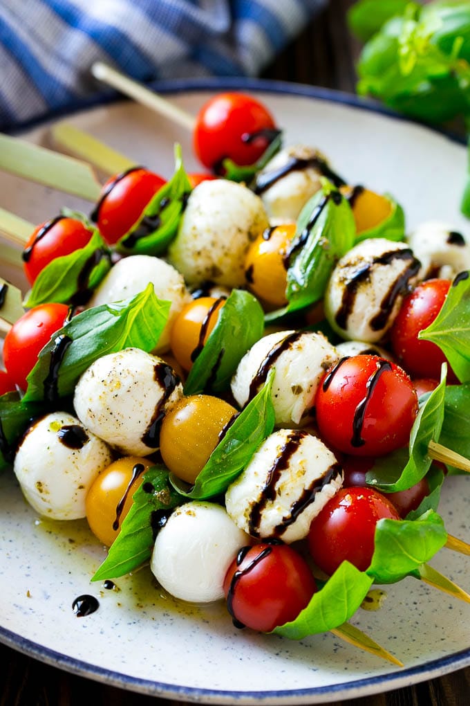 Caprese Skewers | Caprese Kabobs | Caprese Appetizer #tomato #mozzarella #basil #caprese #appetizer #sraye Caprese skewers with mozzarella, cherry tomatoes and basil with balsamic glaze.
