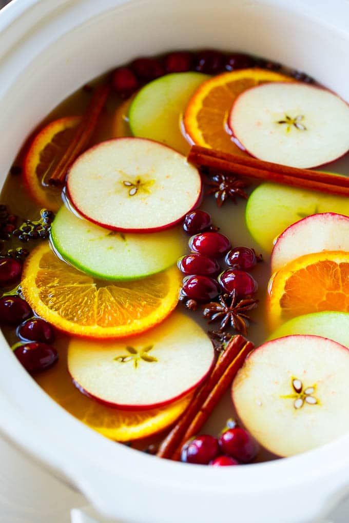 Slow Cooker Apple Cider | Mulled Apple Cider | Crockpot Apple Cider #cider #apple #applecider #drink #crockpot #slowcooker #sraye Slow cooker apple cider with oranges, apple slices, cinnamon sticks and cranberries.