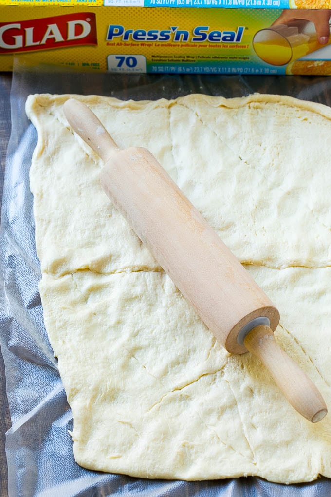 Veggie Pizza Recipe | Crescent Veggie Pizza | Vegetable Pizza Recipe | Holiday Appetizer | Homemade Veggie Pizza #pizza #veggies #vegetarian #appetizer #sraye Crescent roll dough rolled out into a rectangle.