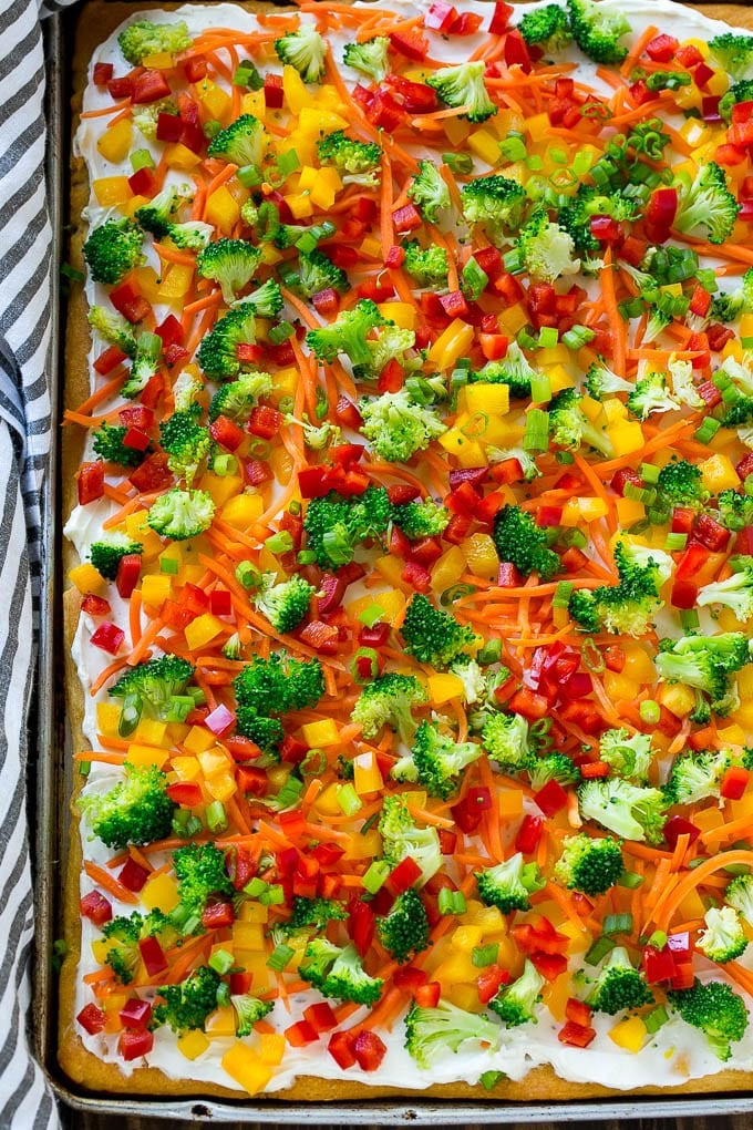 Veggie Pizza Recipe | Crescent Veggie Pizza | Vegetable Pizza Recipe | Holiday Appetizer | Homemade Veggie Pizza #pizza #veggies #vegetarian #appetizer #sraye A sheet pan of crescent veggie pizza.