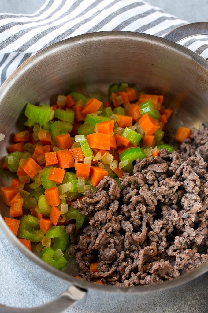 Hamburger Soup Recipe | Hamburger Stew | Ground Beef Soup #hamburger #soup #groundbeef #stew #dinner #sraye Ground beef is added to the vegetables in a pot.