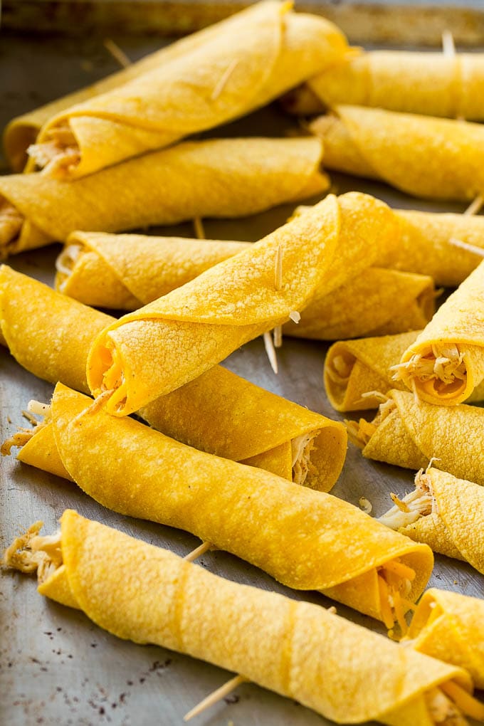 Chicken Taquitos Recipe | Baked Chicken Taquitos | Fried Chicken Taquitos | Mexican Appetizer | Chicken Tortillas #taquitos #chicken #appetizer #tortillas #mexicanfood #sraye Rolled up chicken taquitos ready for the fryer or oven.