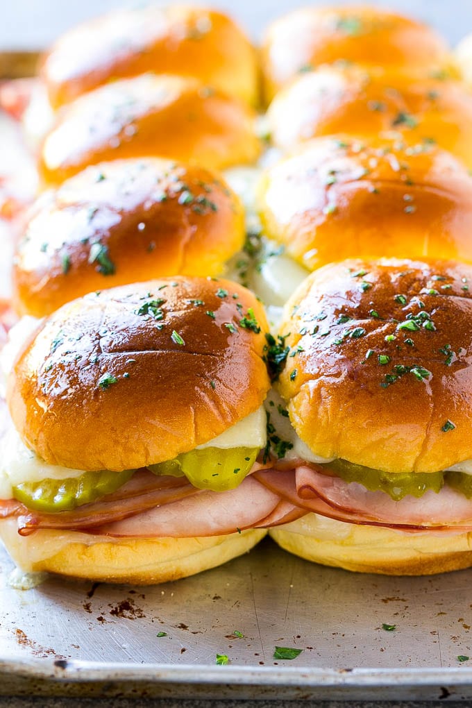 Cuban Sliders Recipe | Cuban Sandwich Recipe | Slider Sandwiches | Ham and Cheese Sliders #sliders #sandwiches #ham #cheese #appetizer #sraye A sheet pan of Cuban slider sandwiches.