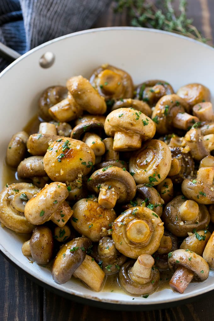 Garlic Mushrooms Recipe | Steakhouse Mushrooms | Sauteed Mushrooms | Garlic Butter Mushrooms | Mushroom Side Dish #mushrooms #butter #keto #lowcarb #dinner #sidedish #sraye A pan full of cooked mushrooms coated in garlic butter.