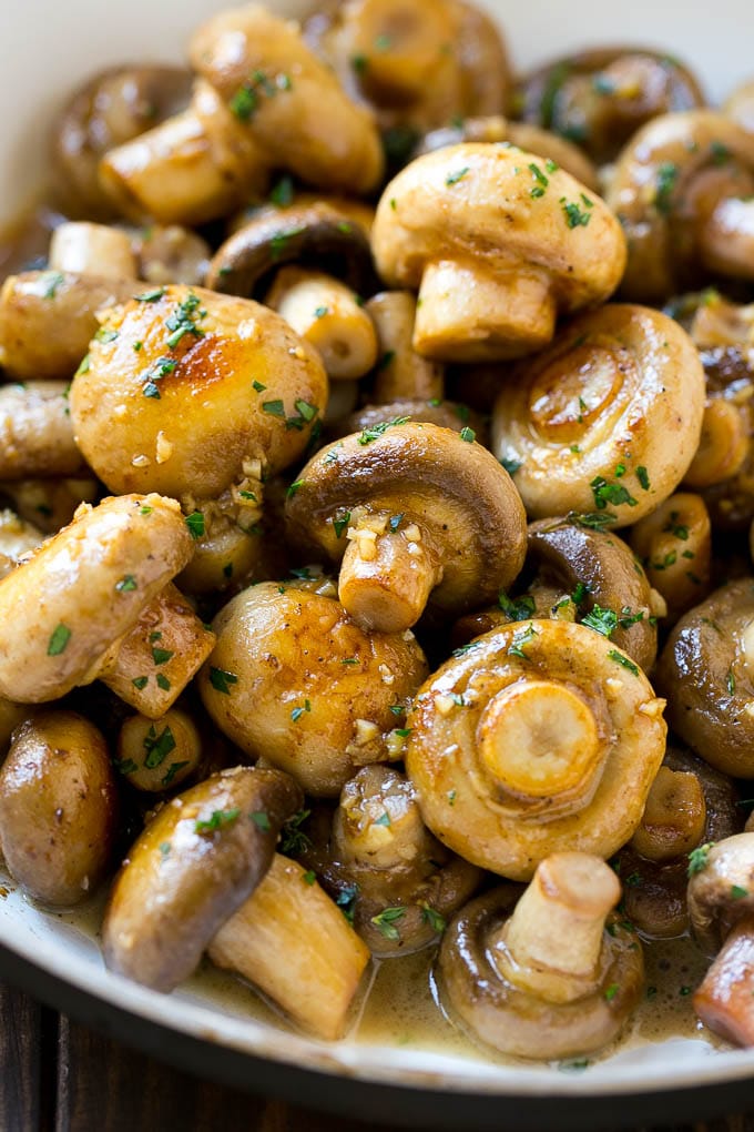 Garlic Mushrooms Recipe | Steakhouse Mushrooms | Sauteed Mushrooms | Garlic Butter Mushrooms | Mushroom Side Dish #mushrooms #butter #keto #lowcarb #dinner #sidedish #sraye Garlic mushrooms in an herb and butter sauce in a frying pan.