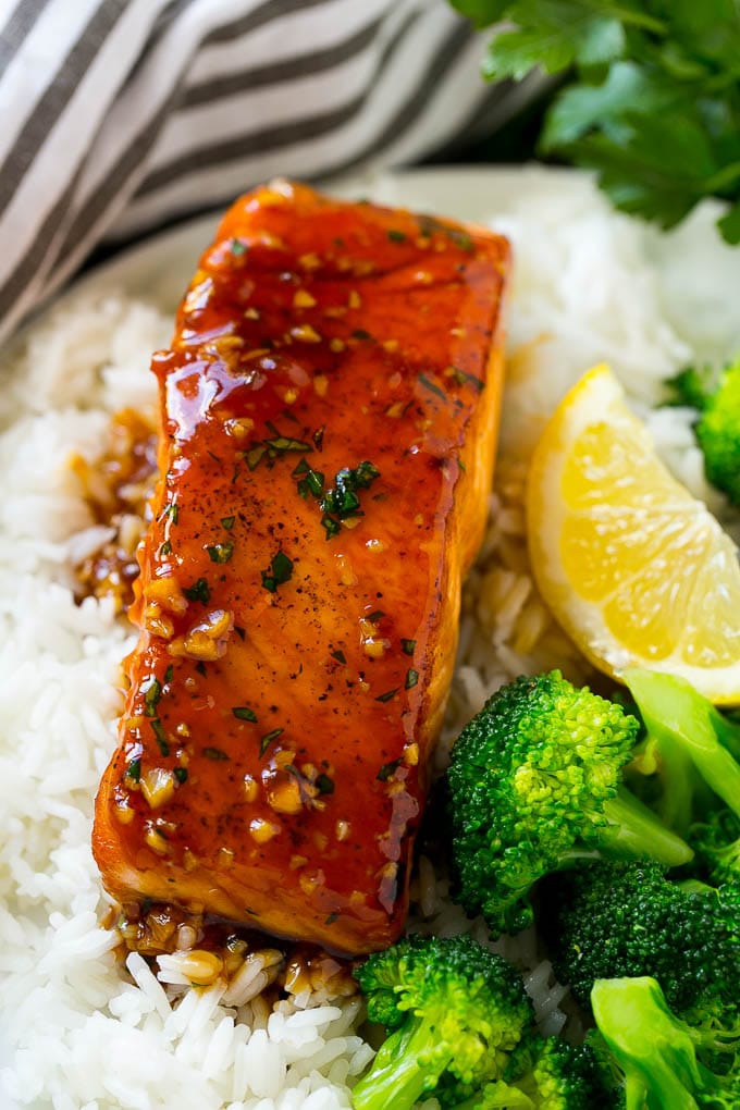 Honey Garlic Salmon Recipe | Asian Salmon Recipe | Healthy Salmon Recipe #salmon #fish #seafood #healthy #dinner #sraye Honey garlic salmon served over rice with a side of broccoli.