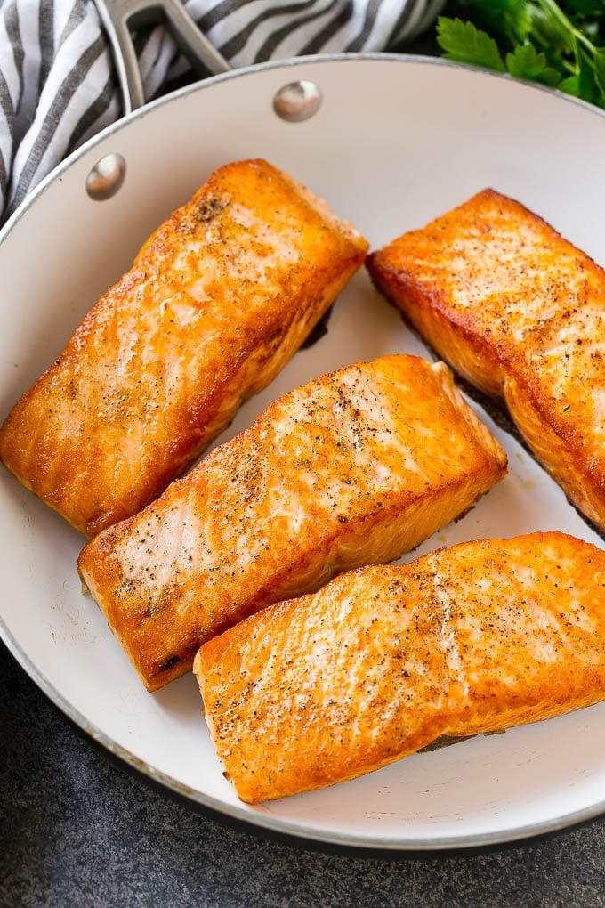 Honey Garlic Salmon Recipe | Asian Salmon Recipe | Healthy Salmon Recipe #salmon #fish #seafood #healthy #dinner #sraye Seared salmon fillets in a frying pan.